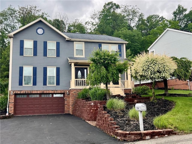 758 Venango Ave, Shaler, PA 15209 - view of front of house featuring a garage, asphalt driveway, and brick siding