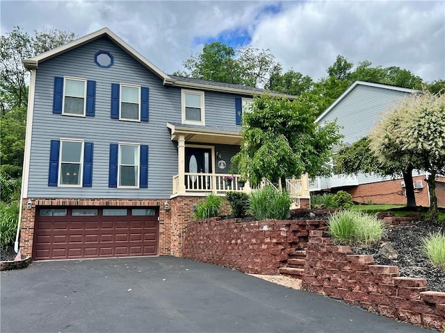 758 Venango Ave, Shaler, PA 15209 - view of front facade with a garage, asphalt driveway, and brick siding