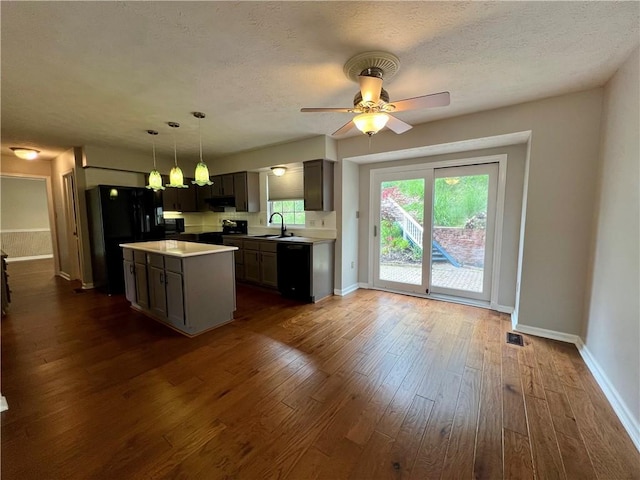 758 Venango Ave, Shaler, PA 15209 - kitchen featuring black appliances, a sink, dark wood-style floors, light countertops, and baseboards