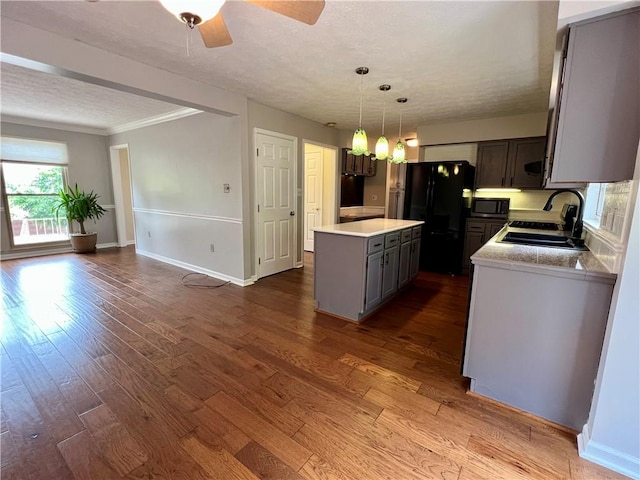 758 Venango Ave, Shaler, PA 15209 - kitchen featuring a sink, freestanding refrigerator, gray cabinetry, a textured ceiling, and a center island