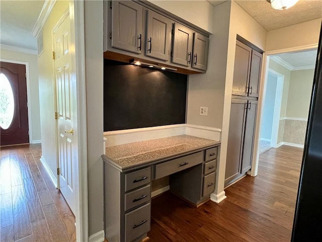 758 Venango Ave, Shaler, PA 15209 - unfurnished office featuring dark wood-style floors, crown molding, baseboards, and built in study area
