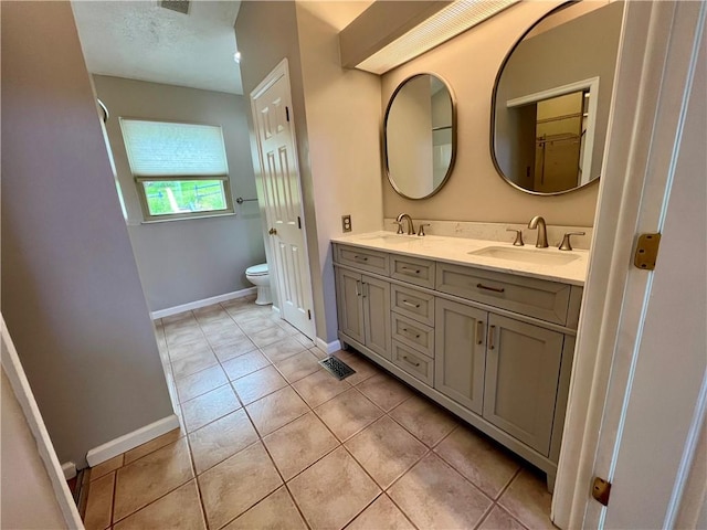 758 Venango Ave, Shaler, PA 15209 - full bathroom featuring toilet, double vanity, tile patterned flooring, and baseboards