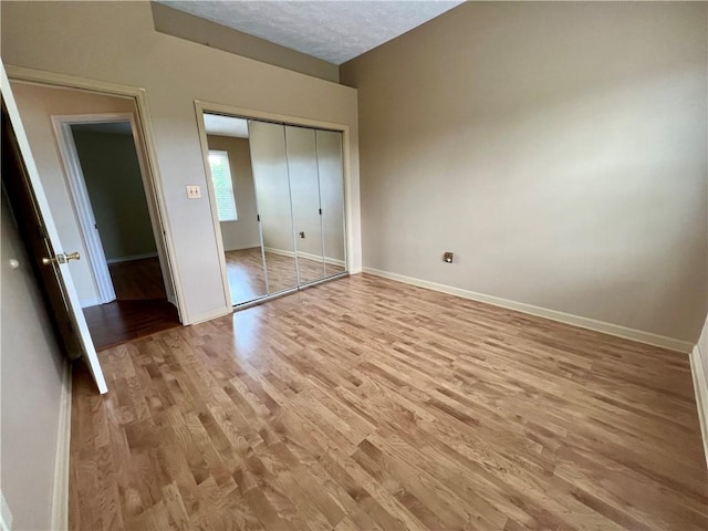 758 Venango Ave, Shaler, PA 15209 - unfurnished bedroom with light wood-style floors, baseboards, and a closet