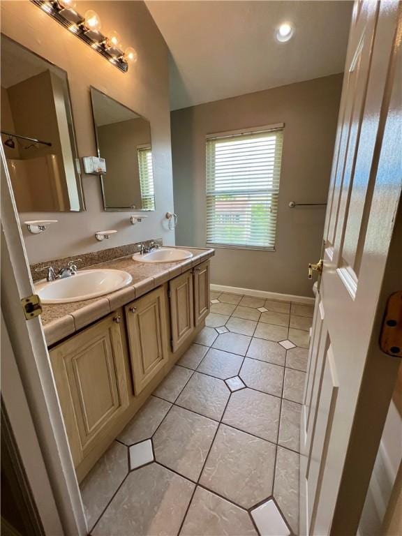 758 Venango Ave, Shaler, PA 15209 - bathroom with double vanity, tile patterned flooring, and baseboards