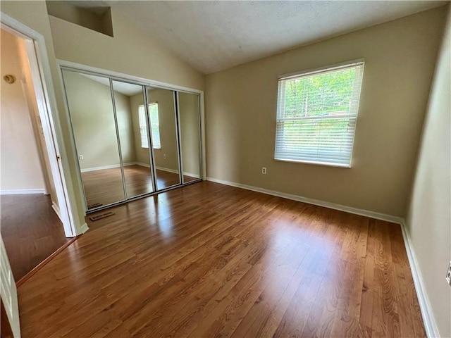 758 Venango Ave, Shaler, PA 15209 - unfurnished bedroom featuring vaulted ceiling, wood finished floors, a closet, and baseboards