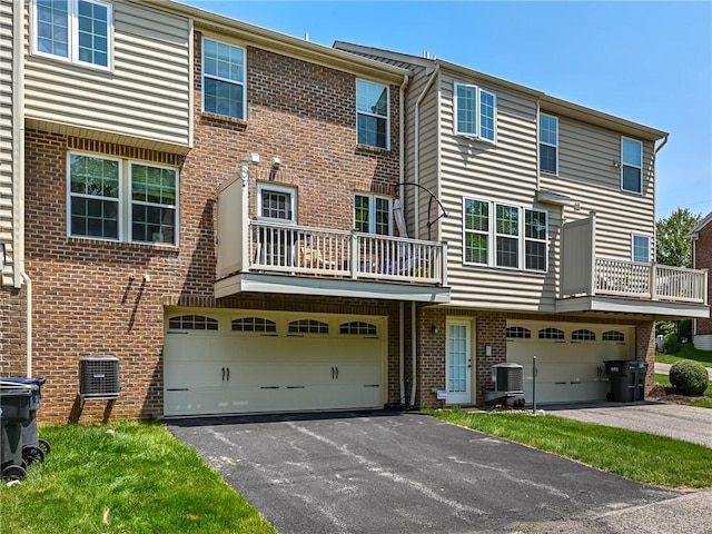 411 Fairgate, Pine Twp, PA 15090 - view of front of house with a balcony, asphalt driveway, an attached garage, and brick siding