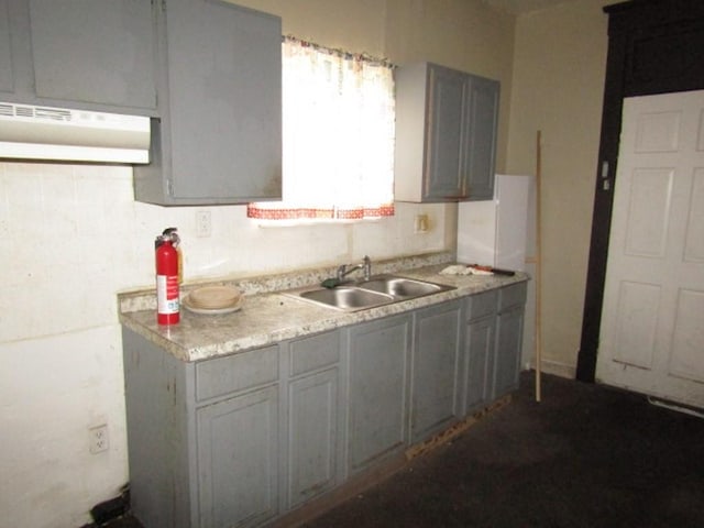 1433 Arlington Ave, Arlington, PA 15210 - kitchen featuring a sink, light countertops, and gray cabinets