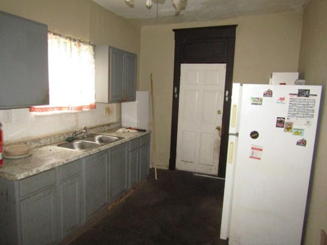 1433 Arlington Ave, Arlington, PA 15210 - kitchen with freestanding refrigerator, a sink, and light countertops