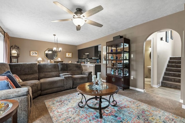 14 Cinque Terra Pl, Finleyville, PA 15332 - living area with light carpet, arched walkways, a textured ceiling, ceiling fan, and stairs