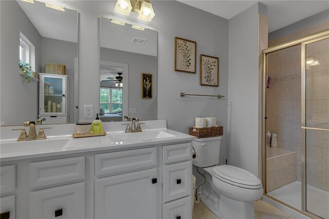 109 Jessica Ct, Chippewa Twp, PA 15010 - ensuite bathroom with double vanity, ceiling fan, toilet, a shower stall, and tile patterned flooring