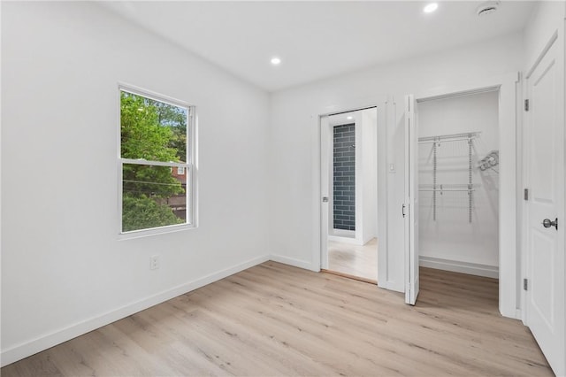 36 W Bellecrest, Brentwood, PA 15227 - unfurnished bedroom featuring light wood finished floors, recessed lighting, baseboards, a walk in closet, and a closet