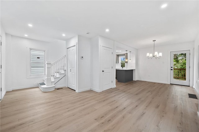 36 W Bellecrest, Brentwood, PA 15227 - unfurnished living room with a chandelier, light wood-type flooring, baseboards, stairs, and recessed lighting