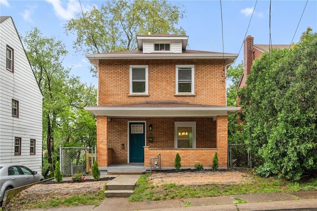 36 W Bellecrest, Brentwood, PA 15227 - traditional style home featuring a gate, brick siding, covered porch, and roof with shingles