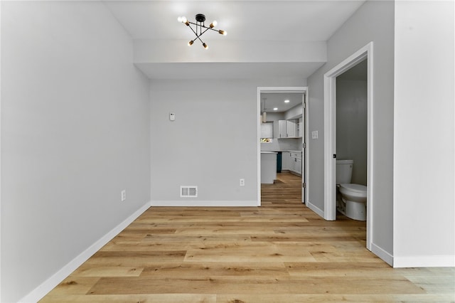 2126 Lautner St, Troy Hill, PA 15212 - unfurnished dining area featuring light wood-style floors, a chandelier, baseboards, and recessed lighting