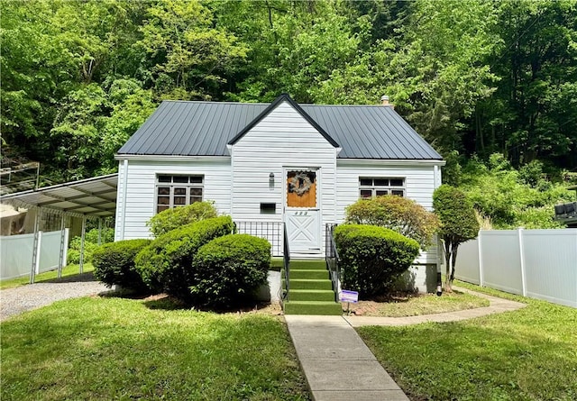 413 Days Run Rd, East Deer, PA 15030 - view of front of house featuring a carport, gravel driveway, metal roof, and a wooded view