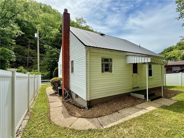 413 Days Run Rd, East Deer, PA 15030 - view of side of home featuring a chimney and metal roof
