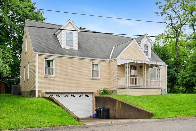 2501 Middletown Rd, Ingram, PA 15205 - cape cod house with an attached garage, brick siding, a front lawn, covered porch, and central AC