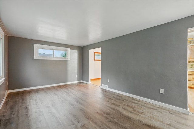 124 Plum St, Franklin Twp, PA 16117 - empty room with wood finished floors and baseboards