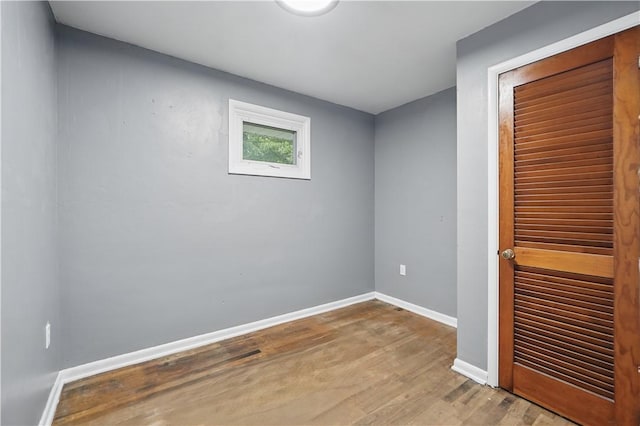 124 Plum St, Franklin Twp, PA 16117 - unfurnished bedroom featuring a closet, wood finished floors, and baseboards