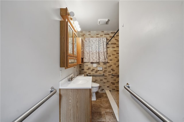 124 Plum St, Franklin Twp, PA 16117 - bathroom with tile walls, tiled shower, vanity, and toilet