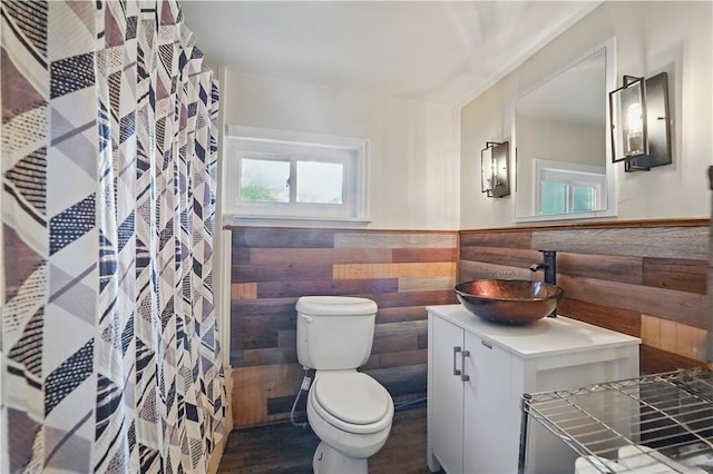 627 Seminary Ave, South Fayette, PA 15071 - bathroom featuring tile walls, wainscoting, vanity, toilet, and a shower with curtain