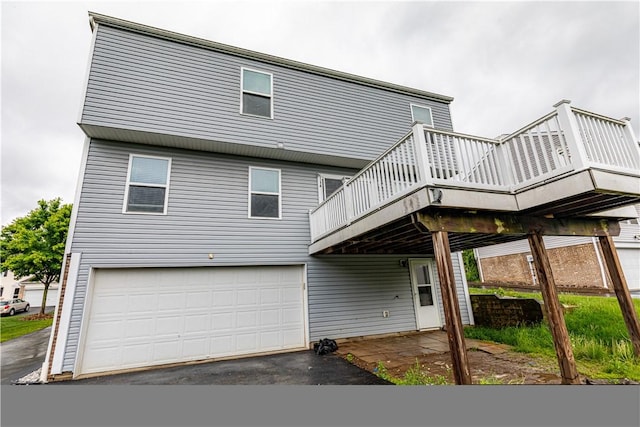 220 Chinkapin Dr, Natrona Hts/Harrison Twp, PA 15065 - back of house with a deck, a garage, and asphalt driveway