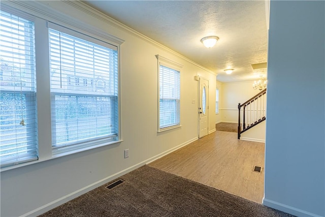 220 Chinkapin Dr, Natrona Hts/Harrison Twp, PA 15065 - carpeted foyer with a chandelier, baseboards, stairway, a textured ceiling, and ornamental molding