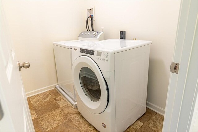 220 Chinkapin Dr, Natrona Hts/Harrison Twp, PA 15065 - washroom with washing machine and clothes dryer, baseboards, and light stone finish floors