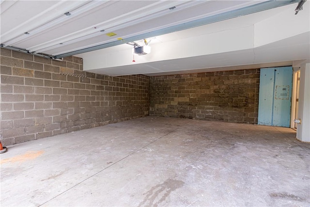 220 Chinkapin Dr, Natrona Hts/Harrison Twp, PA 15065 - garage featuring a garage door opener and concrete block wall