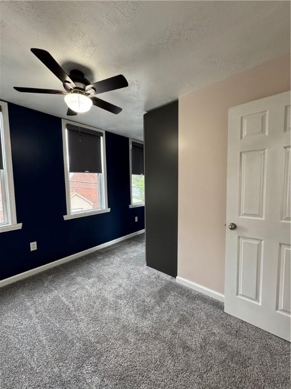 2422 Salisbury St, South Side, PA 15210 - carpeted empty room featuring a textured ceiling, a ceiling fan, and baseboards