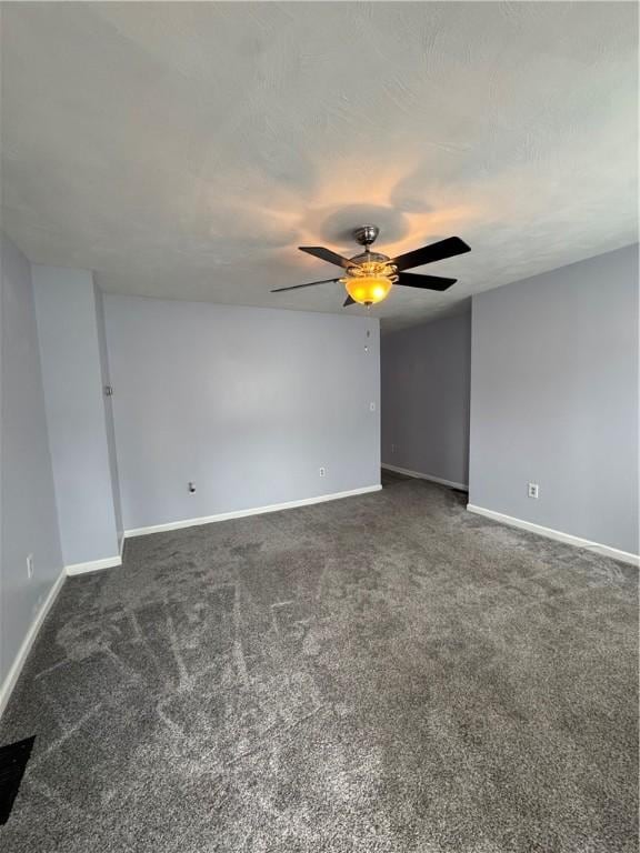 2422 Salisbury St, South Side, PA 15210 - empty room with dark carpet, baseboards, and a ceiling fan
