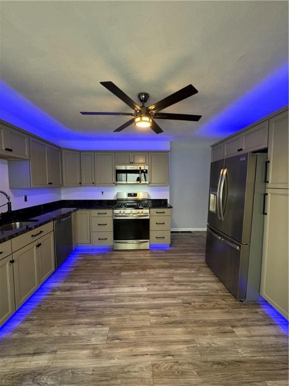 2422 Salisbury St, South Side, PA 15210 - kitchen with appliances with stainless steel finishes, a sink, dark countertops, and ceiling fan