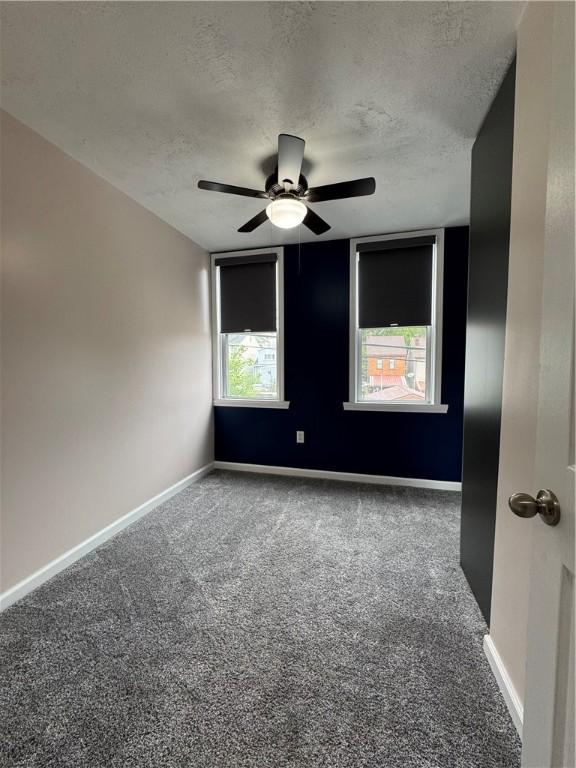 2422 Salisbury St, South Side, PA 15210 - spare room featuring carpet, a textured ceiling, a ceiling fan, and baseboards