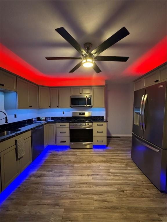 2422 Salisbury St, South Side, PA 15210 - kitchen with stainless steel appliances, a sink, dark countertops, and ceiling fan