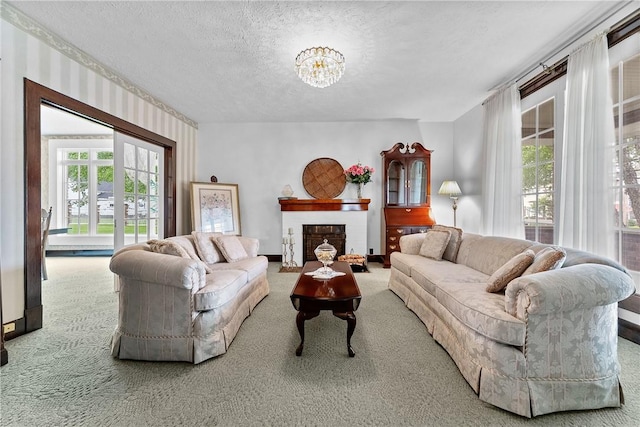 534 N Main St, Masontown, PA 15461 - carpeted living room with a textured ceiling, healthy amount of natural light, a fireplace, and a chandelier