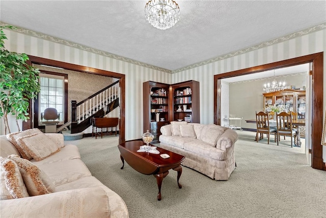 534 N Main St, Masontown, PA 15461 - carpeted living room with wallpapered walls, a chandelier, a textured ceiling, and stairway