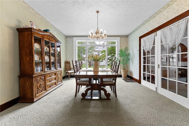 534 N Main St, Masontown, PA 15461 - dining space featuring carpet flooring, a textured ceiling, a chandelier, wallpapered walls, and baseboards