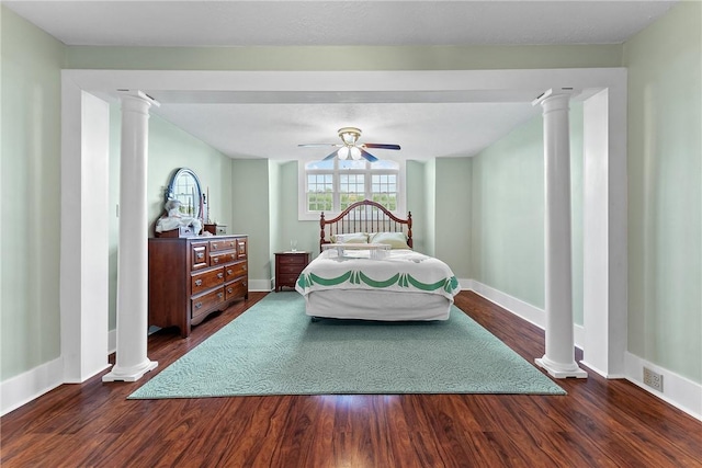 534 N Main St, Masontown, PA 15461 - bedroom with dark wood-style floors, decorative columns, baseboards, and ceiling fan