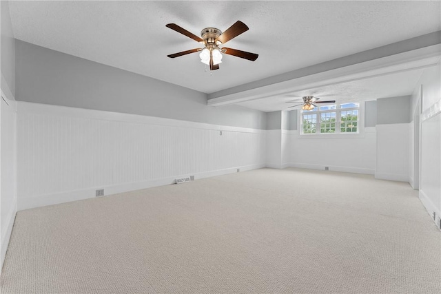 534 N Main St, Masontown, PA 15461 - carpeted spare room with ceiling fan, a wainscoted wall, and a textured ceiling