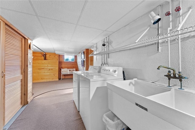 534 N Main St, Masontown, PA 15461 - laundry room featuring wood walls, separate washer and dryer, a textured wall, and carpet flooring