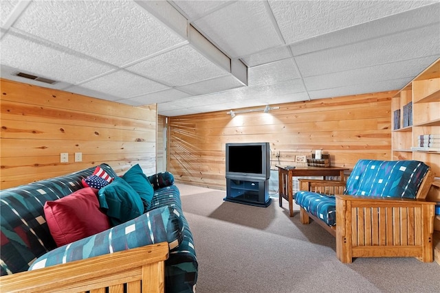534 N Main St, Masontown, PA 15461 - living room with carpet floors, wood walls, and a drop ceiling