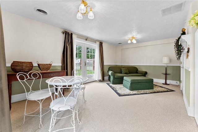 534 N Main St, Masontown, PA 15461 - living area with french doors, carpet, baseboards, and a textured ceiling