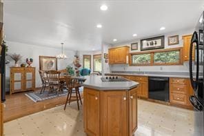 208 Kozy Cor, Middlesex Twp, PA 16059 - kitchen with brown cabinetry, black appliances, a center island, a chandelier, and recessed lighting