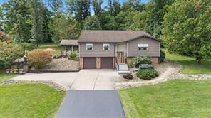 208 Kozy Cor, Middlesex Twp, PA 16059 - bi-level home featuring concrete driveway, a garage, and a front yard