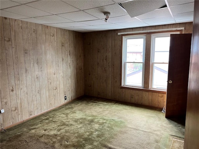 505 Monongahela Ave, Glassport, PA 15045 - carpeted spare room with wooden walls, a paneled ceiling, and baseboards