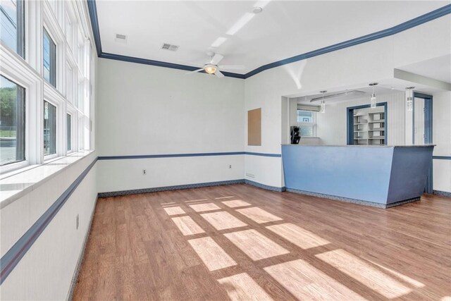 144 S 20th St, South Side, PA 15203 - unfurnished living room with light wood finished floors, a ceiling fan, crown molding, and baseboards