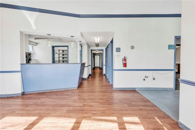 144 S 20th St, South Side, PA 15203 - spare room featuring wood finished floors, ornamental molding, and baseboards