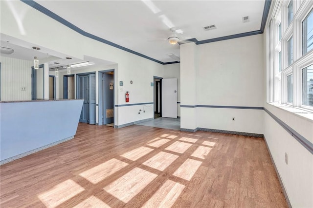144 S 20th St, South Side, PA 15203 - empty room with light wood-style flooring, ornamental molding, a ceiling fan, and baseboards
