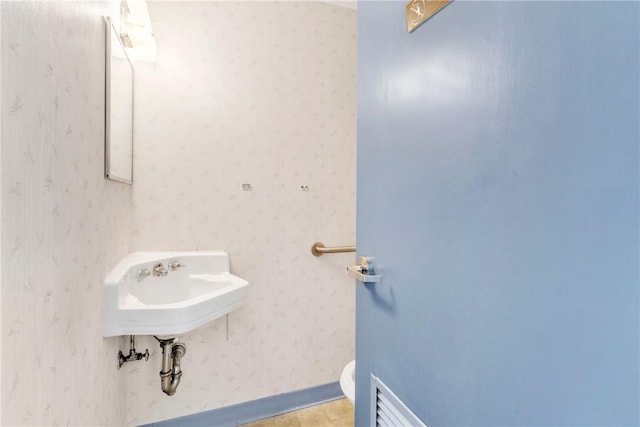 144 S 20th St, South Side, PA 15203 - bathroom featuring toilet and wood finished floors