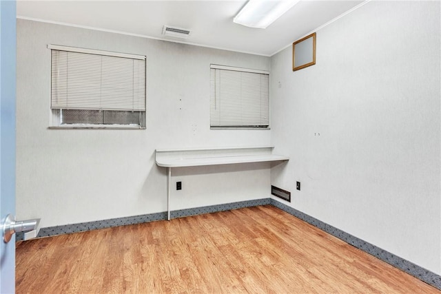 144 S 20th St, South Side, PA 15203 - empty room featuring wood finished floors, ornamental molding, and baseboards